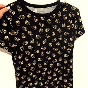 A black crop top with cheetah printed skulls
